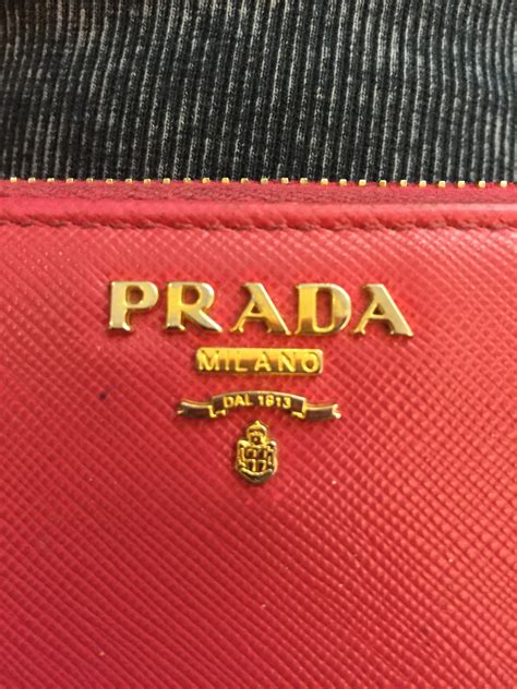 how to tell if prada wallet is real|prada real or real.